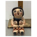 Jemez pottery storyteller figure signed D. Sando