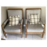 Pair of arm chairs with pillows