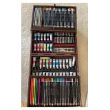 Artist pencils, paints, and oil pastels in case