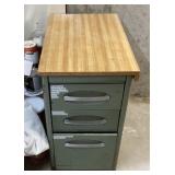 Metal file cabinet and top drawer contents