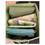 Tote with plastic tablecloths and paper napkins