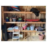 Contents of shelf with sleds & garden supplies