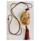 Carved tagua palm nut Santa pendant on cord