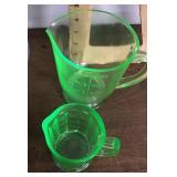 2 green Depression uranium glass pitchers