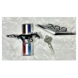 2 Ford Mustang car emblems and Mustang key