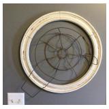Wire basket and round picture frame wall art
