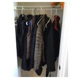 Coats and vests in hall closet