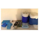 Camping gear -- coolers, light sticks, poncho