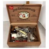 Cigar box with bottle openers, corks, etc.