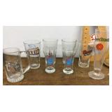 8 assorted beer glasses