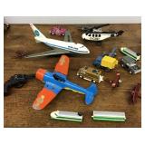 Group of toy airplanes and vehicles