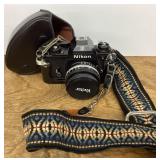 Nikon camera with case and strap