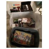 Books and board games in 3 totes
