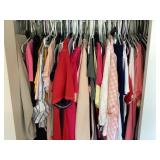 Clothes on hangers in closet