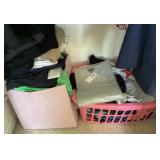 Clothes, storage, & laundry basket on closet floor