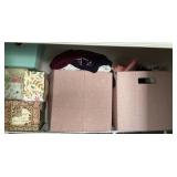 2 containers of clothes and decorative storage