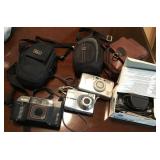 Collection of digital cameras and cases