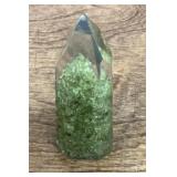 Peridot encased in resin tower