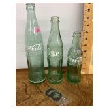 3 old Coke bottles and bottle opener