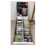 Box of sports cards plus card sleeves