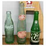3 old soda bottles