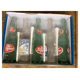 5 old soda bottles