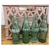 Milk crate of Coca-Cola bottles