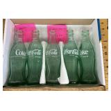 5 old Coca-Cola bottles