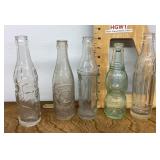 5 old soda bottles