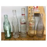 5 old soda bottles