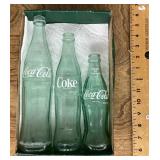 3 old Coca-Cola bottles