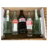 5 old Coca-Cola bottles