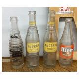 4 old soda bottles