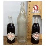 Coke and Vess soda bottles