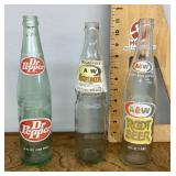 3 old soda bottles