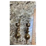 Brass wall sconces with glass hurricanes