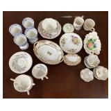 Assorted porcelain plates, cups, dishes