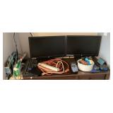 Desk contents with 2 monitors and office supplies