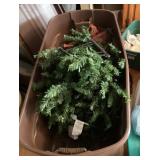 Artificial Christmas tree in tote