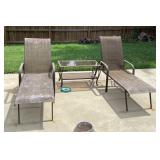2 patio loungers and glass top side table