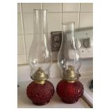 2 ruby Daisy & Button oil lamps