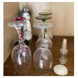 Wine glasses, angel, bottle on top of armoire