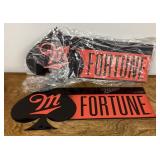2 Miller Fortune metal signs