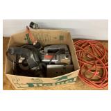 Box of old power tools and extension cord