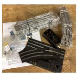 Box of Lionel train track and accessories