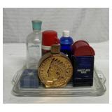 Glass perfume bottles and Pyrex fridge dish lid