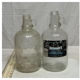 2 half gallon glass jugs