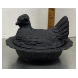 Black glass hen on a nest