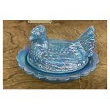 Blue iridescent glass hen on a nest
