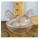 Pink glass hen on nest